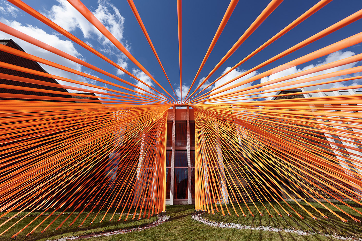A pavilion of orange threads. United but separate to reflect on the historical moment we are living in