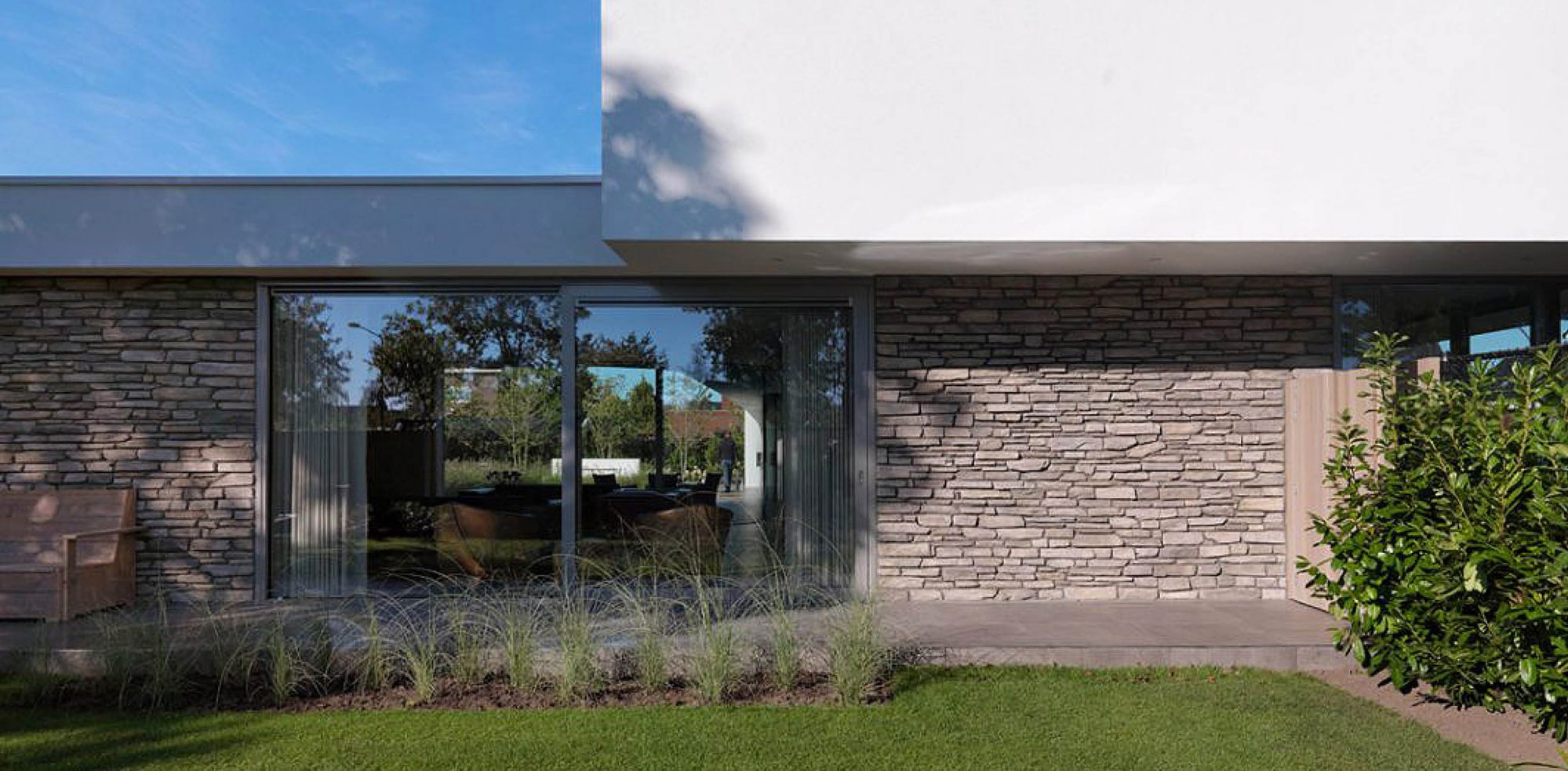 Contrast between glass, stone and white plaster