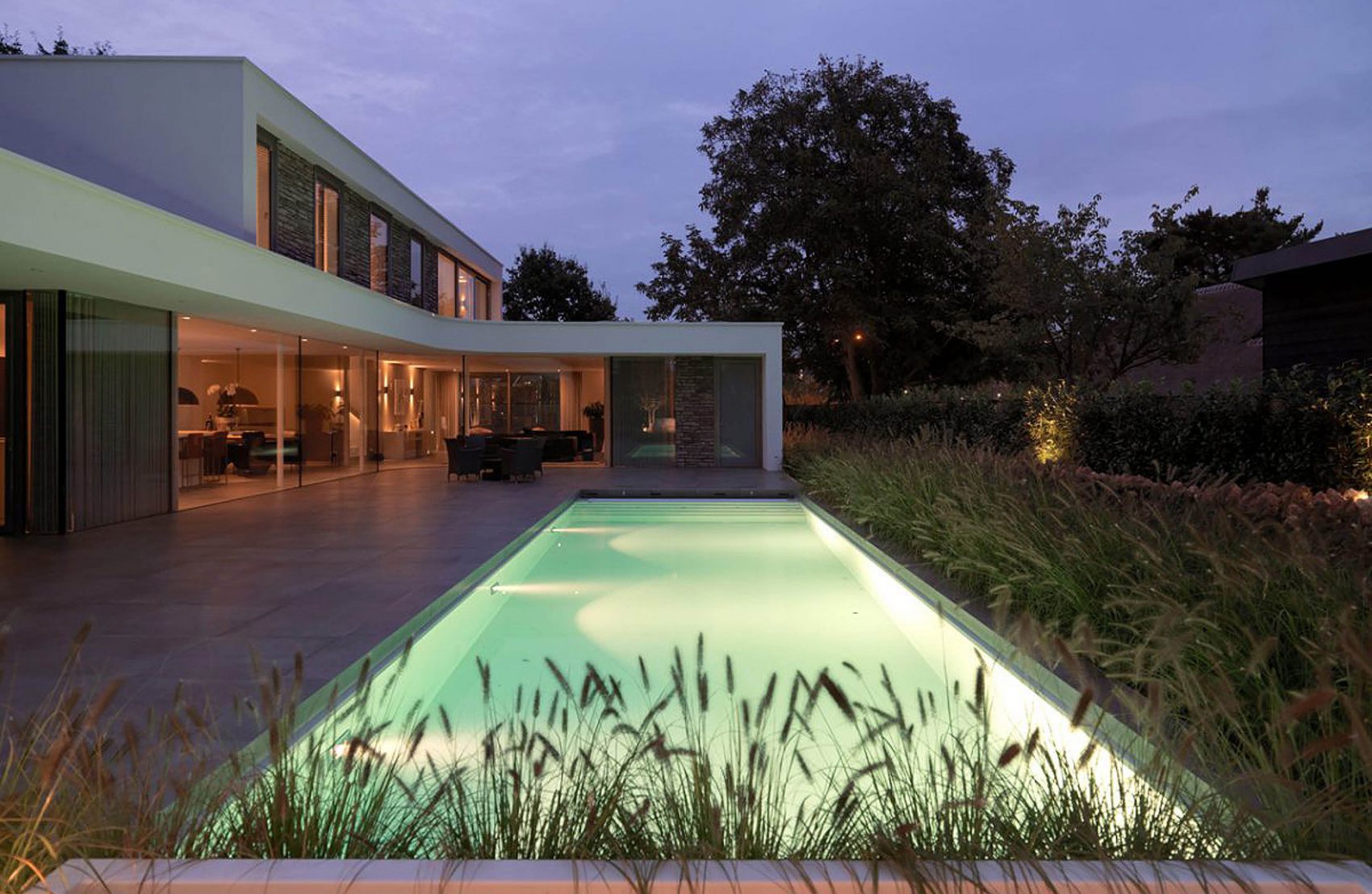 Illuminated pool for a stone-clad villa