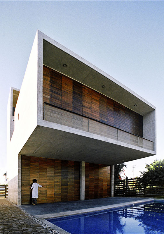 Wooden and concrete house with swimming pool