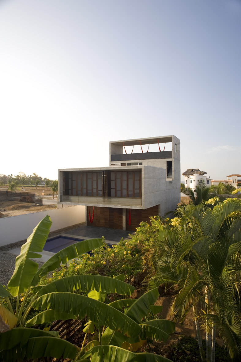 Wooden and concrete house with swimming pool