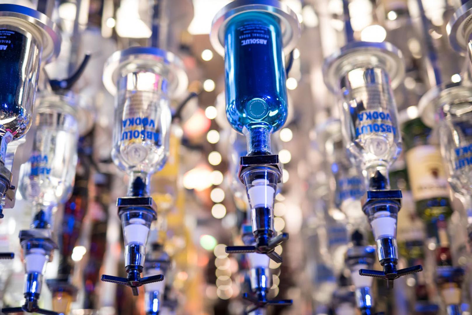 Robot barman colored bottles