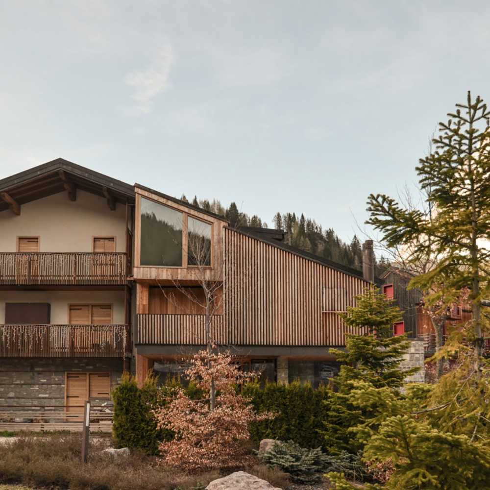 Restyling and expansion of a chalet. Wood is used to connect with tradition while innovating its shapes