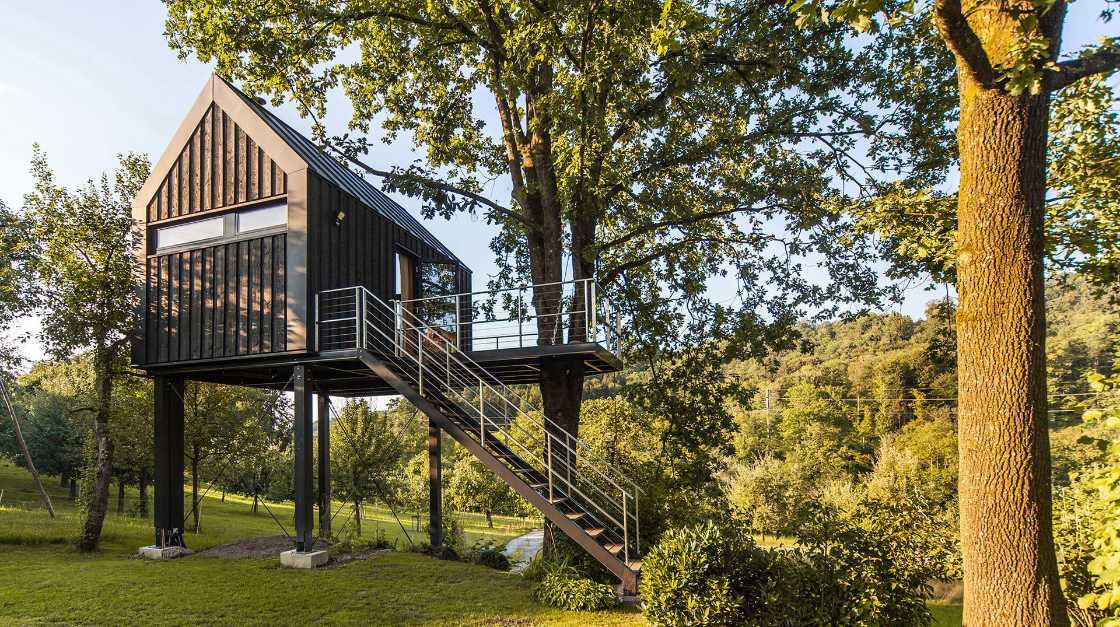 Tree house in Switzerland. A comfortable environment among the leaves of the trees