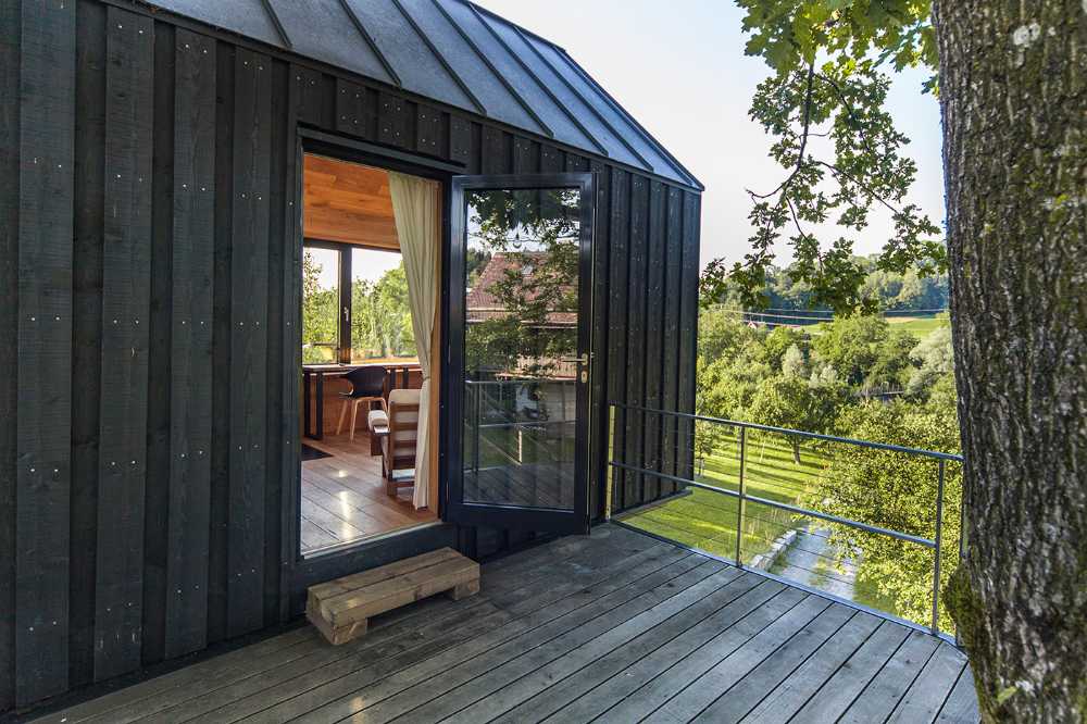 Tree house in Switzerland. A comfortable environment among the leaves of the trees