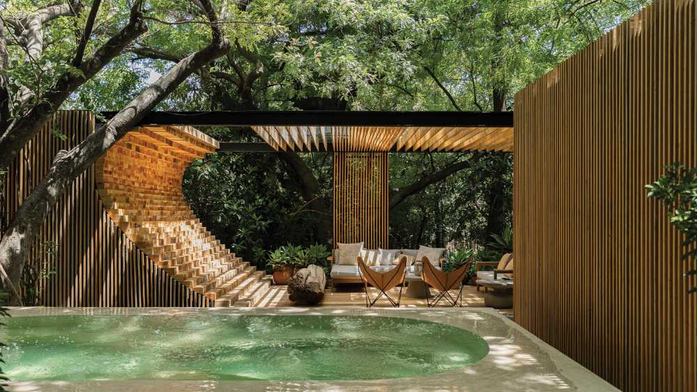 Villa nestled in an orchard in Mexico. Sensual textures among trees and courtyards