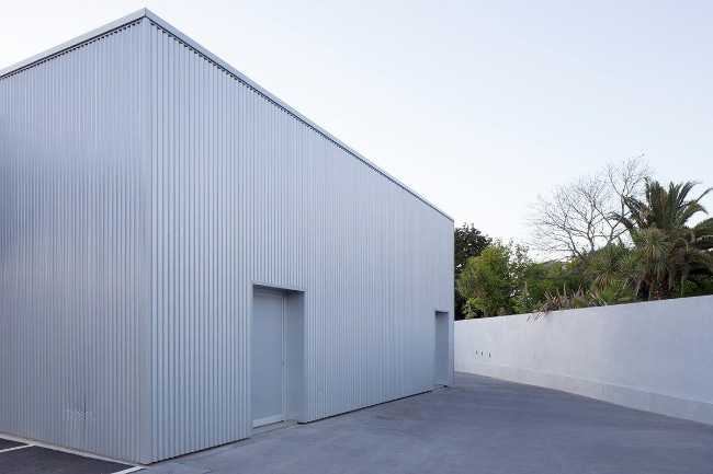 Refurbished petrol station. Corrugated sheet metal for the new cladding