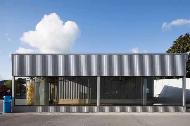 Refurbished petrol station. Corrugated sheet metal for the new cladding