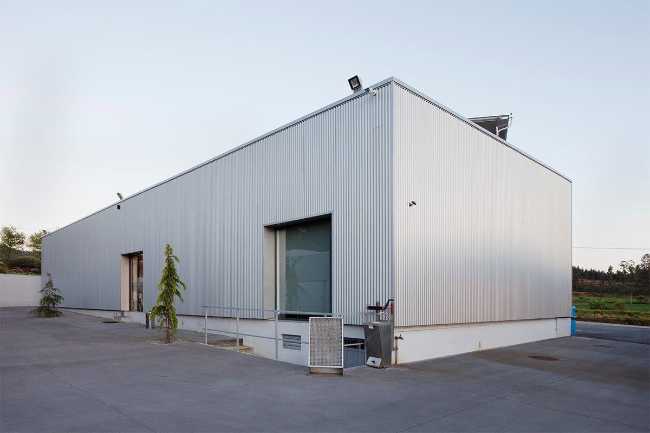 Refurbished petrol station. Corrugated sheet metal for the new cladding