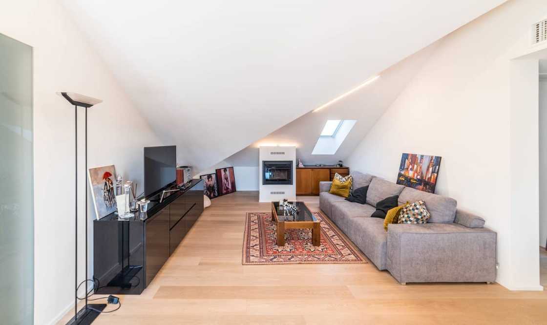 Attic transformed into living space. White and natural light to expand the rooms