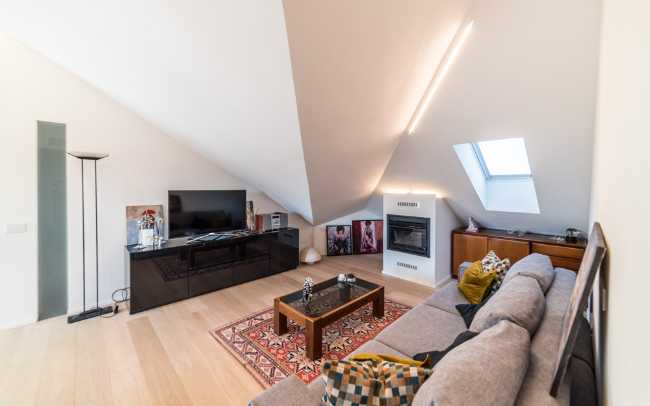 Attic transformed into living space. White and natural light to expand the rooms