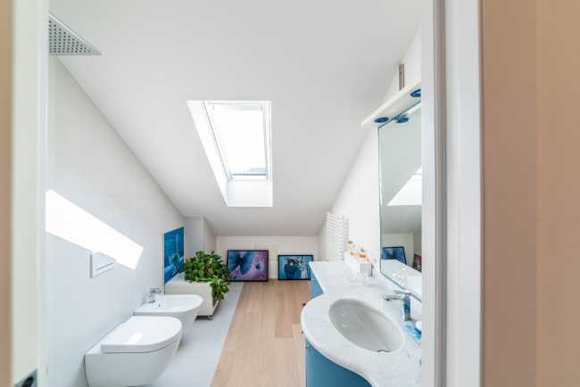 Attic transformed into living space. White and natural light to expand the rooms
