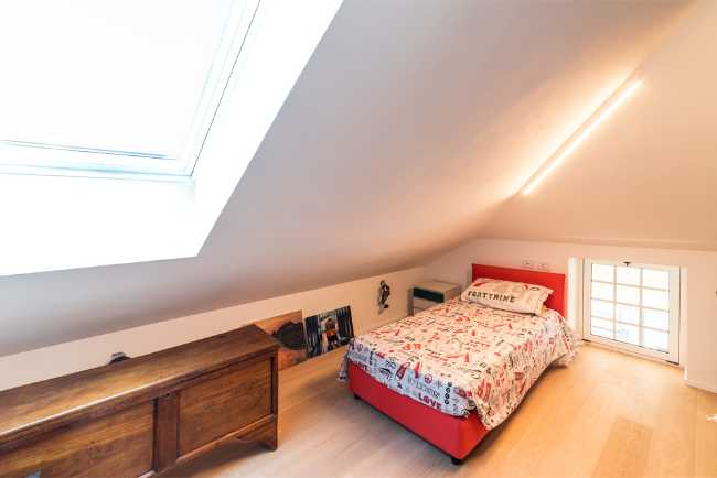 Attic transformed into living space. White and natural light to expand the rooms