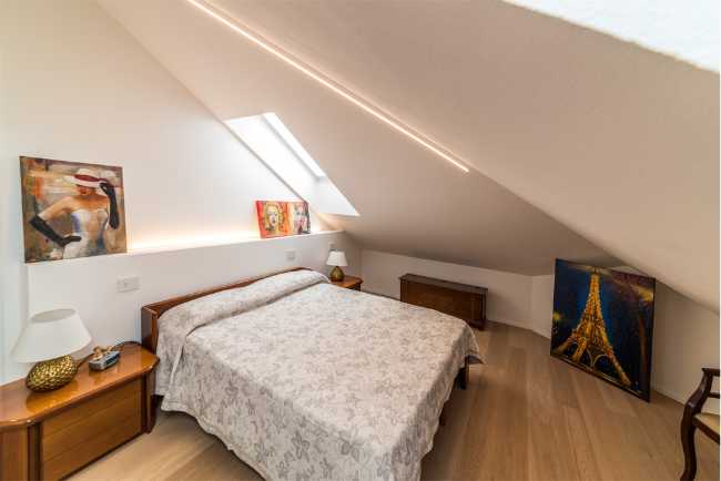 Attic transformed into living space. White and natural light to expand the rooms