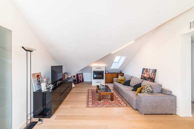 Attic transformed into living space. White and natural light to expand the rooms