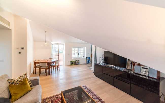 Attic transformed into living space. White and natural light to expand the rooms