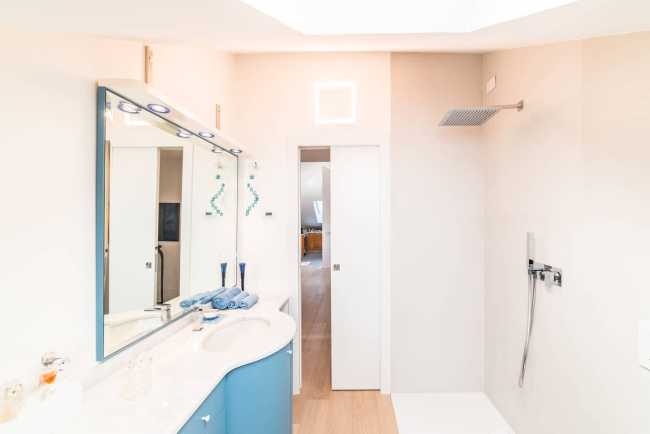 Attic transformed into living space. White and natural light to expand the rooms