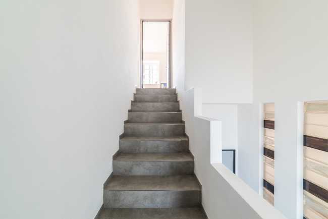 Attic transformed into living space. White and natural light to expand the rooms