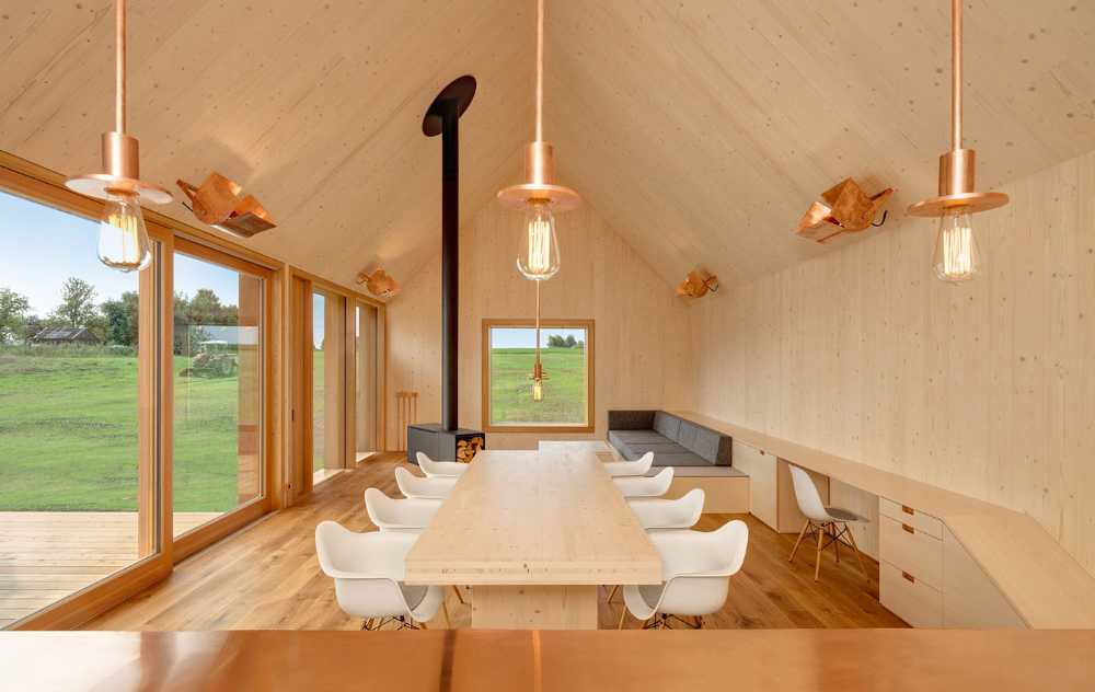 Diseño minimalista para una casa de madera. Armonía entre la madera de alerce exterior y el paisaje