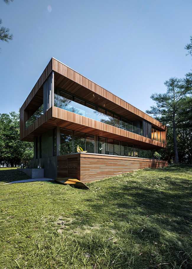 Housing on the shores of a lake. Horizontal structure in a picturesque natural landscape