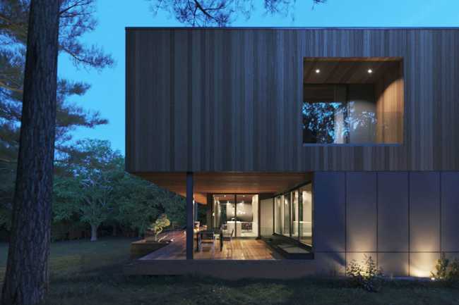 Housing on the shores of a lake. Horizontal structure in a picturesque natural landscape