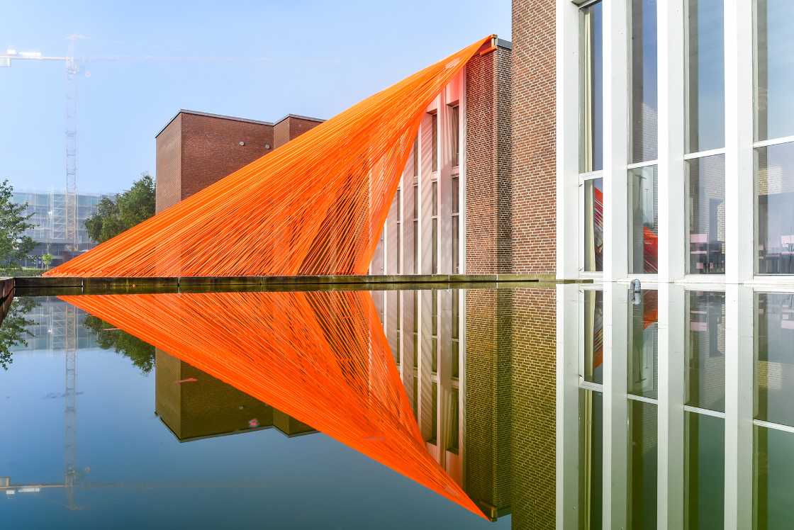 A pavilion of orange threads. United but separate to reflect on the historical moment we are living in