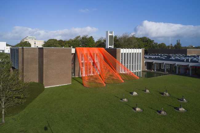 A pavilion of orange threads. United but separate to reflect on the historical moment we are living in