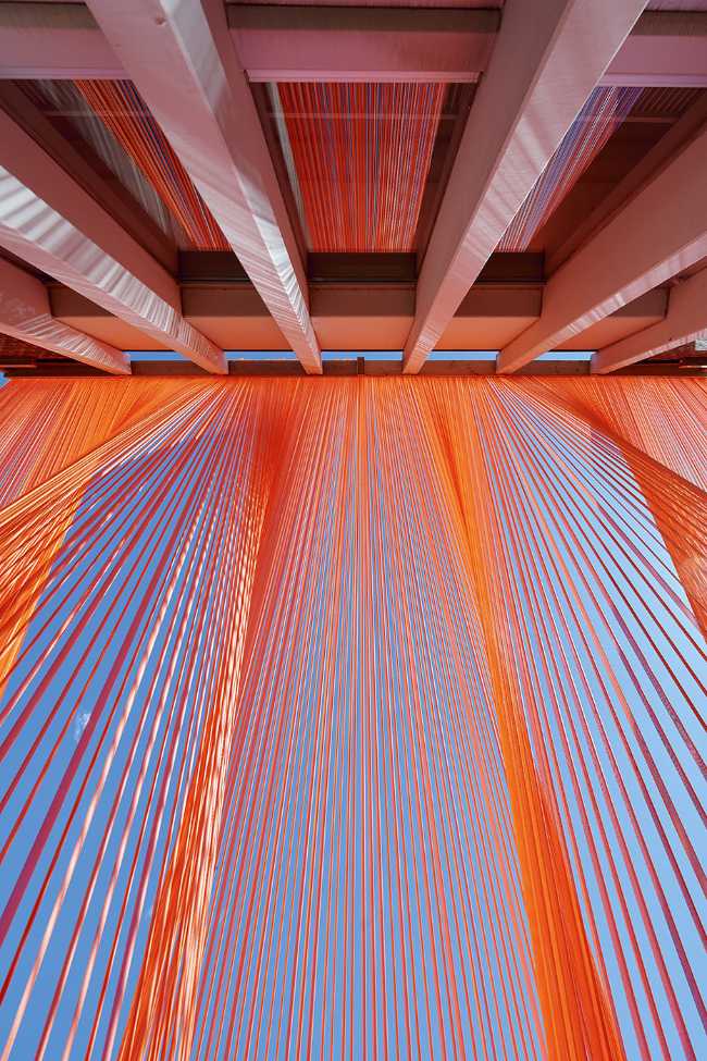 A pavilion of orange threads. United but separate to reflect on the historical moment we are living in