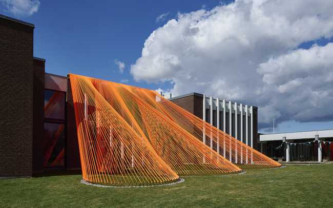 A pavilion of orange threads. United but separate to reflect on the historical moment we are living in