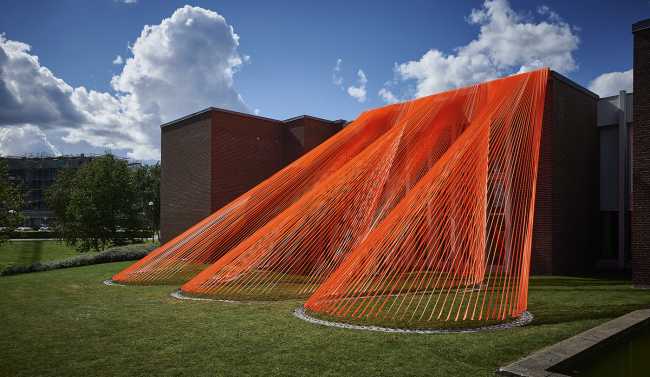 A pavilion of orange threads. United but separate to reflect on the historical moment we are living in