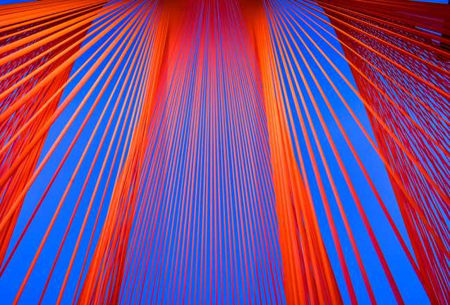 A pavilion of orange threads. United but separate to reflect on the historical moment we are living in