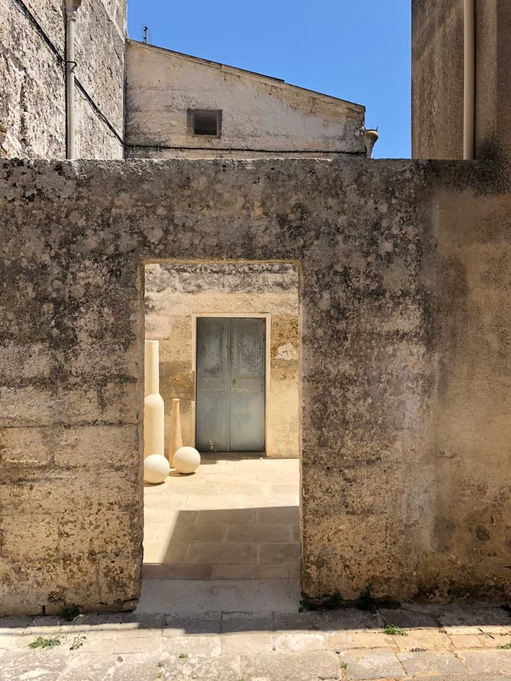 Local stone terraces and blue Mediterranean-style windows. Salentine beauty brought back to life