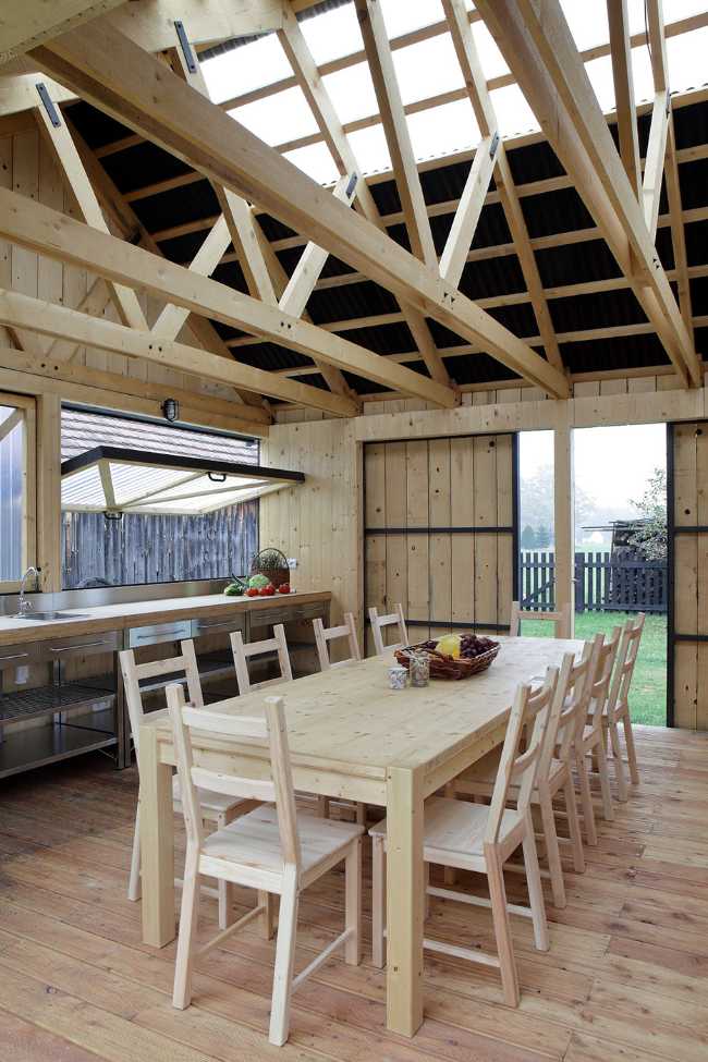 Farm surrounded by the picturesque Bohemian nature. New wooden farm building