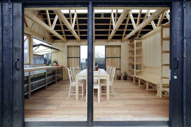 Farm surrounded by the picturesque Bohemian nature. New wooden farm building