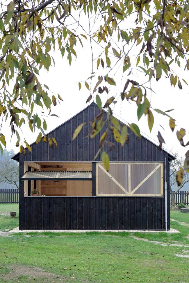 Farm surrounded by the picturesque Bohemian nature. New wooden farm building