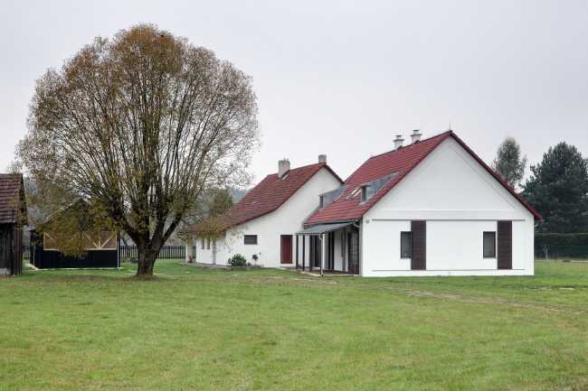 Farm surrounded by the picturesque Bohemian nature. New wooden farm building
