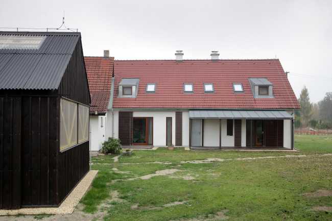 Farm surrounded by the picturesque Bohemian nature. New wooden farm building