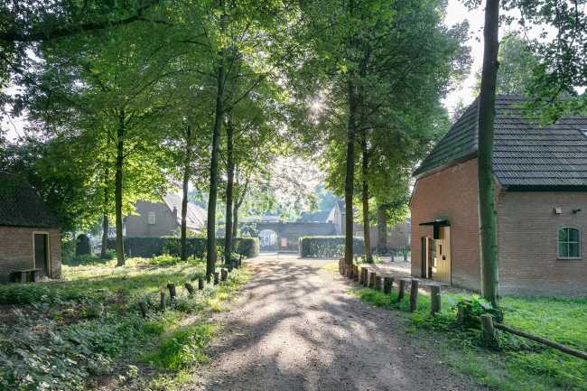 From barn of a historic estate to museum. Context-sensitive adaptive reuse project
