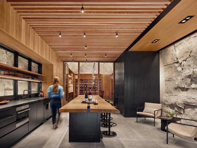 Wine shop carved in the rock. Tasting wine inside a small cave