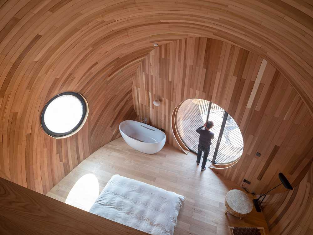The Seeds: four futuristic wooden houses with an ellipsoidal shape