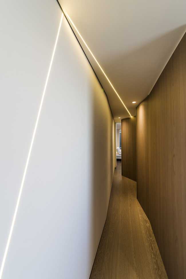 Volúmenes dinámicos y materialidad de madera maciza: la reestructuración crea atmósferas contemporáneas en torno al jardín de invierno