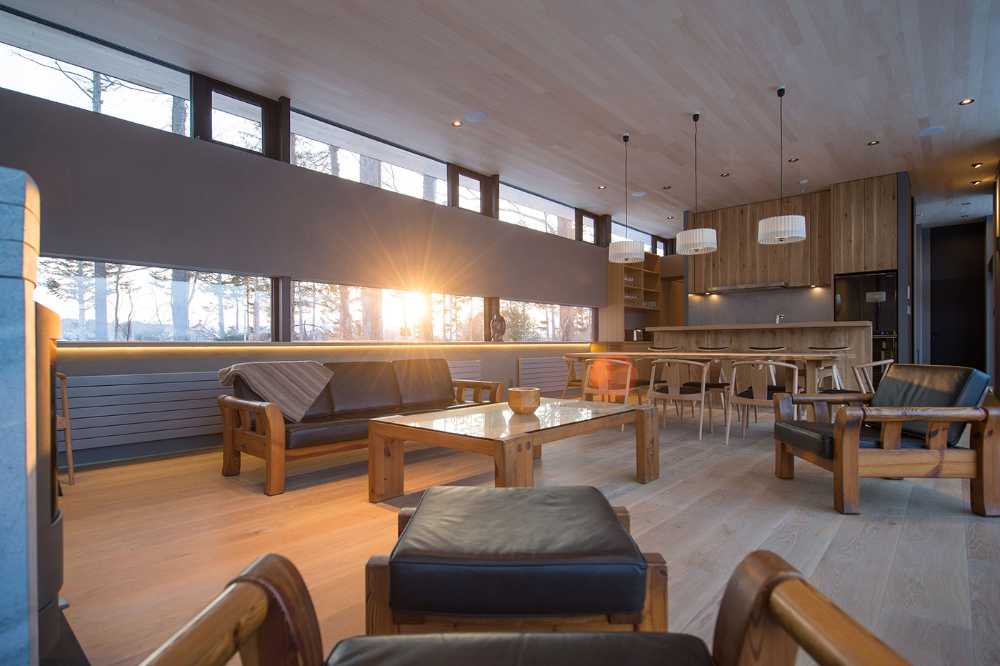 Architectural dialogue between cedar and metal for the Hiyoku home, a backdrop of Japan's snow-capped mountains