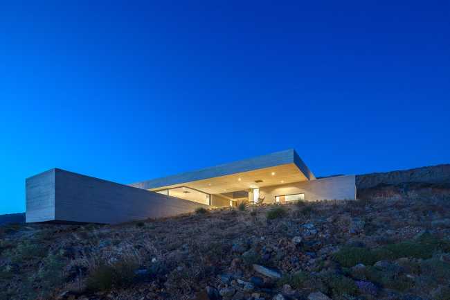 Lap Pool House: an artificial cave carved into the natural landscape of a Greek island