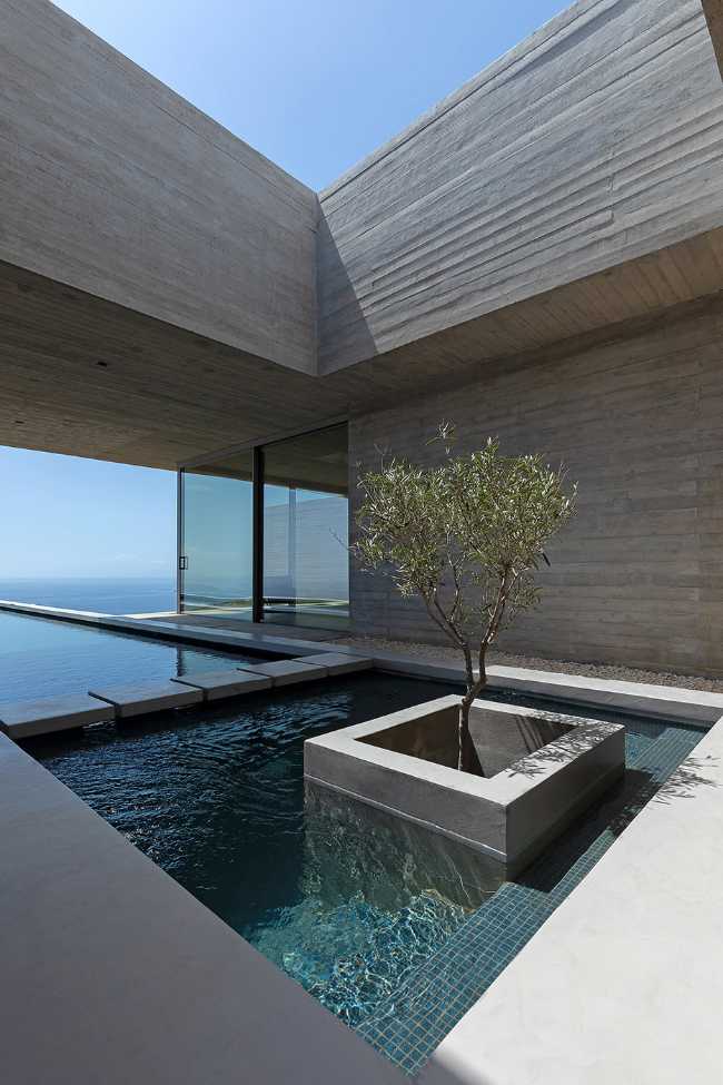 Lap Pool House: an artificial cave carved into the natural landscape of a Greek island