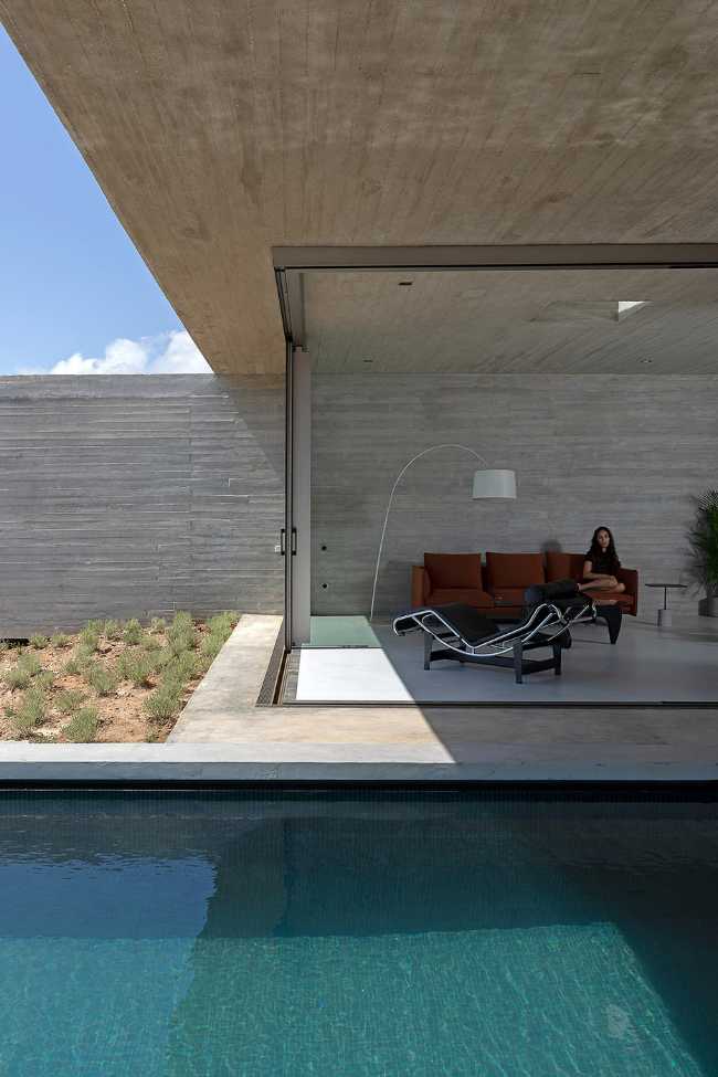 Lap Pool House: an artificial cave carved into the natural landscape of a Greek island