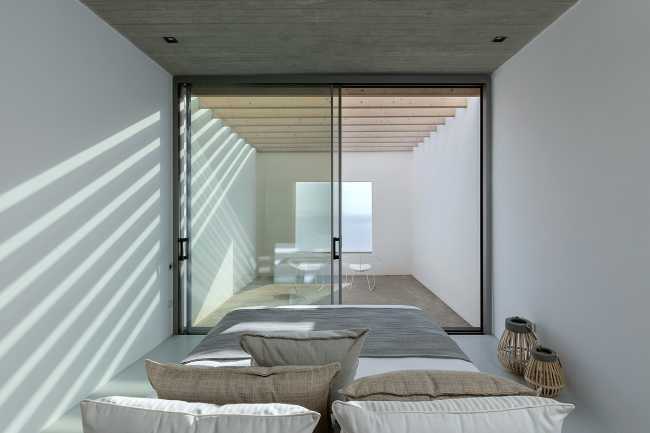 Lap Pool House: an artificial cave carved into the natural landscape of a Greek island
