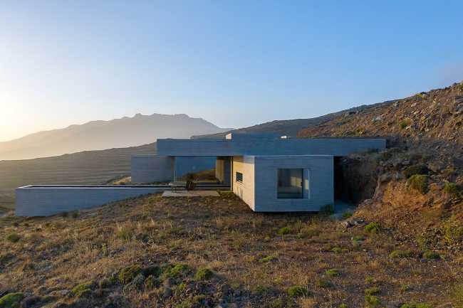 Lap Pool House: an artificial cave carved into the natural landscape of a Greek island