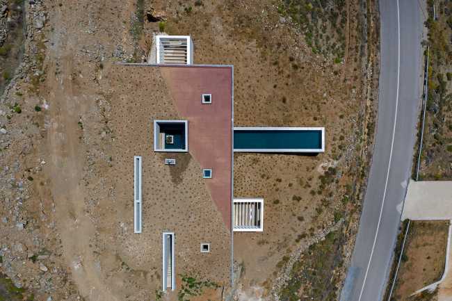 Lap Pool House: an artificial cave carved into the natural landscape of a Greek island