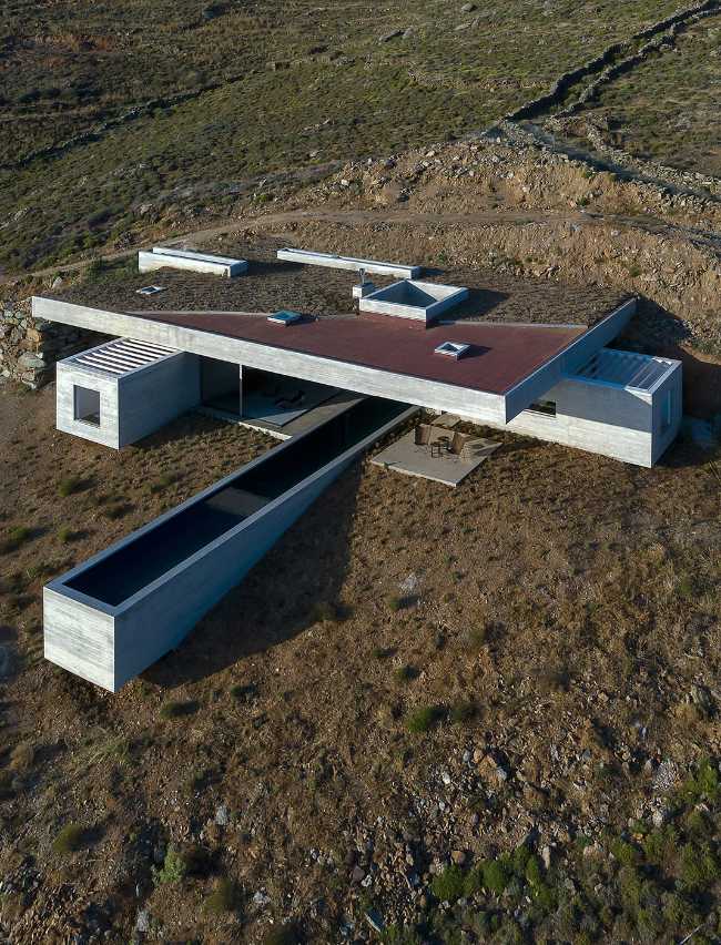 Lap Pool House: an artificial cave carved into the natural landscape of a Greek island