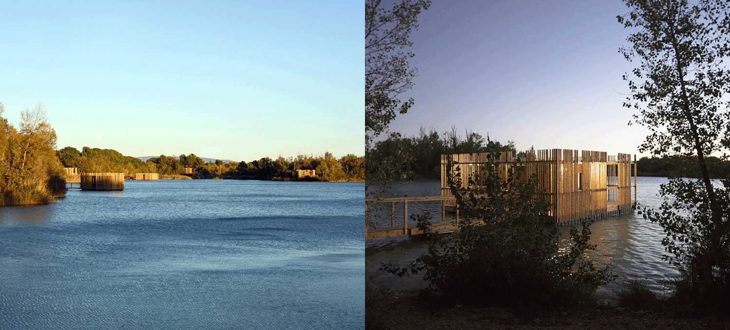 Wooden suites at the Grand Cepage Hotel, resembling the sophisticated nests among the reeds, are reflected in the lake for a primordial living experience